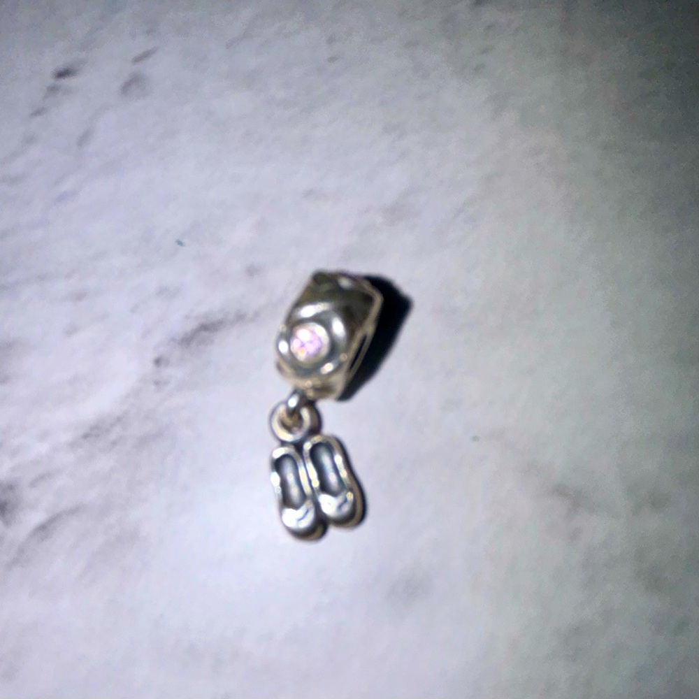 Pandora pink gem and ballet slippers charm.